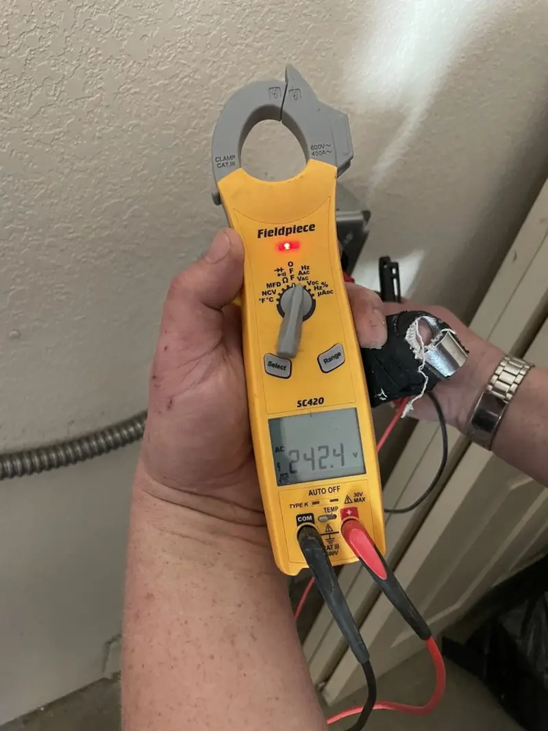 Voltage testing with clamp meter during Generator Installation in Vero Beach South